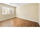 This bedroom has a window with wood-look floors at 1030 Maple Pines Ave, North Las Vegas, NV 89081
