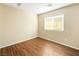 Bright bedroom with wood floors and a window at 1030 Maple Pines Ave, North Las Vegas, NV 89081