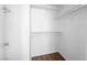 Walk-in closet features shelving and wood floors at 1030 Maple Pines Ave, North Las Vegas, NV 89081