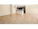 Spacious living room area with tile flooring, neutral walls, and plenty of natural light at 1030 Maple Pines Ave, North Las Vegas, NV 89081