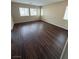 The living room is complete with wood floors and lots of natural light at 1030 Maple Pines Ave, North Las Vegas, NV 89081