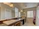 Bathroom featuring double sinks, ample counter space, and a separate shower and toilet area at 10456 Processor Ct, Las Vegas, NV 89129