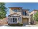 Charming two-story home featuring a balcony, bay window, and a well-maintained front yard at 10456 Processor Ct, Las Vegas, NV 89129