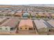 Aerial view of a backyard featuring a patio, desert landscaping, and mountain views at 10943 Artisan Ranch Ave, Las Vegas, NV 89166