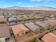An aerial view captures a charming backyard with a paved patio, perfect for outdoor entertaining at 10943 Artisan Ranch Ave, Las Vegas, NV 89166