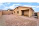 Spacious brick-paved backyard with covered patio and exterior lighting at 10943 Artisan Ranch Ave, Las Vegas, NV 89166