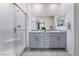 Bright bathroom with double vanity, granite countertops, and walk-in shower at 10943 Artisan Ranch Ave, Las Vegas, NV 89166