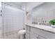 Well-lit bathroom featuring granite countertop, modern fixtures, and decorative mirror at 10943 Artisan Ranch Ave, Las Vegas, NV 89166