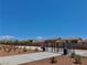 Community park with secure fencing and desert landscaping, offering a safe and natural environment at 10943 Artisan Ranch Ave, Las Vegas, NV 89166