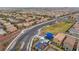 Aerial view of neighborhood amenities, including a playground, basketball court, and green spaces at 10943 Artisan Ranch Ave, Las Vegas, NV 89166