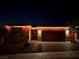 Beautifully lit exterior showcasing its well-manicured landscaping and welcoming entrance at 10943 Artisan Ranch Ave, Las Vegas, NV 89166