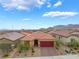 Aerial view of a single-Gathering home with tile roof, desert landscaping, and mountain views at 10943 Artisan Ranch Ave, Las Vegas, NV 89166