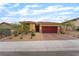Single story home featuring a red tile roof, a brick driveway, and desert landscaping in the front yard at 10943 Artisan Ranch Ave, Las Vegas, NV 89166