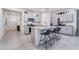 Open kitchen with gray cabinets, stainless steel appliances, granite countertops, and island with seating at 10943 Artisan Ranch Ave, Las Vegas, NV 89166