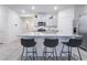 Kitchen featuring gray cabinets, stainless steel appliances, granite countertops, and an island with seating at 10943 Artisan Ranch Ave, Las Vegas, NV 89166