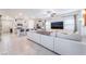 Spacious open-concept living area flows from the kitchen to the living room with natural light and modern decor at 10943 Artisan Ranch Ave, Las Vegas, NV 89166