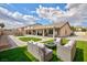 Inviting backyard featuring manicured landscaping, a paved patio, and comfortable outdoor seating for relaxing and entertaining at 1117 Azure Heights Pl, Las Vegas, NV 89110