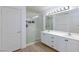 This bathroom offers a double sink vanity, a glass enclosed shower, and modern fixtures at 1117 Azure Heights Pl, Las Vegas, NV 89110