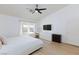 This bedroom offers neutral walls and flooring, a ceiling fan, and two bright windows at 1117 Azure Heights Pl, Las Vegas, NV 89110