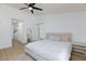 This bedroom offers neutral walls and flooring, a ceiling fan, and two bright windows at 1117 Azure Heights Pl, Las Vegas, NV 89110