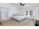 This bright bedroom offers a ceiling fan, large windows, and a light wood floor at 1117 Azure Heights Pl, Las Vegas, NV 89110