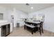 Bright dining area with dark wood table set and convenient access to the kitchen at 1117 Azure Heights Pl, Las Vegas, NV 89110