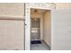 Close-up of the front door with security gate and textured stucco exterior walls at 1117 Azure Heights Pl, Las Vegas, NV 89110