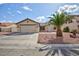 Single-story home featuring a well-maintained lawn and a desert-friendly landscaped front yard at 1117 Azure Heights Pl, Las Vegas, NV 89110