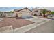 Charming single-story home with low-maintenance landscaping and attached two-car garage at 1117 Azure Heights Pl, Las Vegas, NV 89110