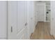 This hallway provides access to multiple rooms and storage through white painted doors at 1117 Azure Heights Pl, Las Vegas, NV 89110