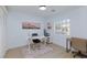 Stylish home office with a modern desk, pink rug, and large window for natural light at 1117 Azure Heights Pl, Las Vegas, NV 89110