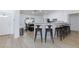 Open kitchen with sleek black bar stools at breakfast bar and view to the front door at 1117 Azure Heights Pl, Las Vegas, NV 89110