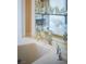 Close-up of luxurious bathroom with marble countertops, chrome fixtures and glass display cabinet at 1413 Iron Hills Ln, Las Vegas, NV 89134