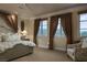 Comfortable bedroom featuring large windows that provide ample natural light and scenic views at 1413 Iron Hills Ln, Las Vegas, NV 89134