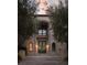 Grand home facade with a balcony, double doors, and stone detailing at 1413 Iron Hills Ln, Las Vegas, NV 89134