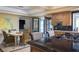 Stylish kitchen with granite countertops and island with seating, seamlessly connects to the dining and living spaces at 1413 Iron Hills Ln, Las Vegas, NV 89134