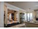 An expansive open-concept living area with seamless transitions to an adjacent room through elegant archways at 1413 Iron Hills Ln, Las Vegas, NV 89134