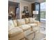 Comfortable living room with stylish couch and large windows to enjoy the view at 1413 Iron Hills Ln, Las Vegas, NV 89134