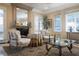 Comfortable sitting room with fireplace, complemented by natural light, decorative accents, and stylish furnishings at 1413 Iron Hills Ln, Las Vegas, NV 89134