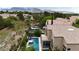A home featuring a balcony overlooking a private rectangular swimming pool and outdoor patio at 1701 Tesara Vista Pl, Las Vegas, NV 89128