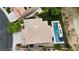 A sprawling home featuring a private backyard with a rectangular swimming pool and verdant landscaping at 1701 Tesara Vista Pl, Las Vegas, NV 89128