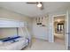 Secondary bedroom includes a bunk bed, neutral paint and carpet at 1701 Tesara Vista Pl, Las Vegas, NV 89128