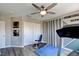 Exercise room with laminate floors, ceiling fan, and exercise equipment at 1701 Tesara Vista Pl, Las Vegas, NV 89128