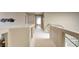 Hallway upstairs with neutral colored walls and light-colored carpet at 1701 Tesara Vista Pl, Las Vegas, NV 89128