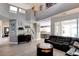 Spacious living room boasting high ceilings, tile floors, and a view of the kitchen at 1701 Tesara Vista Pl, Las Vegas, NV 89128