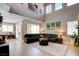 Open concept living area featuring high ceilings, large windows, and access to an outdoor area at 1701 Tesara Vista Pl, Las Vegas, NV 89128