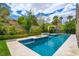 Inviting swimming pool featuring a spa area and beautiful blue tile accents at 1701 Tesara Vista Pl, Las Vegas, NV 89128