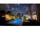 Inviting backyard pool with stylish lounge area, perfect for evening relaxation and enjoyment at 1701 Tesara Vista Pl, Las Vegas, NV 89128
