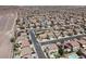Wide aerial view of a residential area with many similar homes and well-maintained streets at 176 Jay Porter Ave, Henderson, NV 89002
