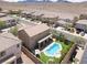 A beautiful, earth-toned home that features a private backyard pool in a well-maintained neighborhood, complemented by mountain views at 176 Jay Porter Ave, Henderson, NV 89002